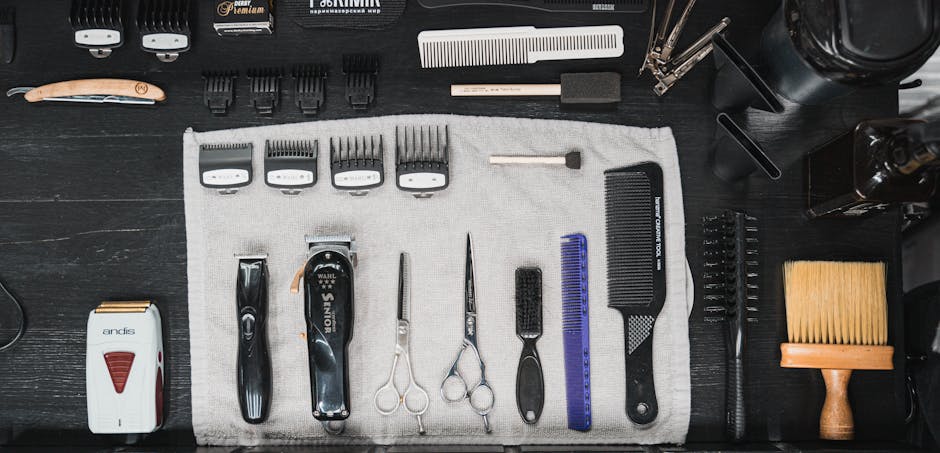 Professional hairdressing tools meticulously arranged in a flat lay, showcasing combs, clippers, scissors, and more.